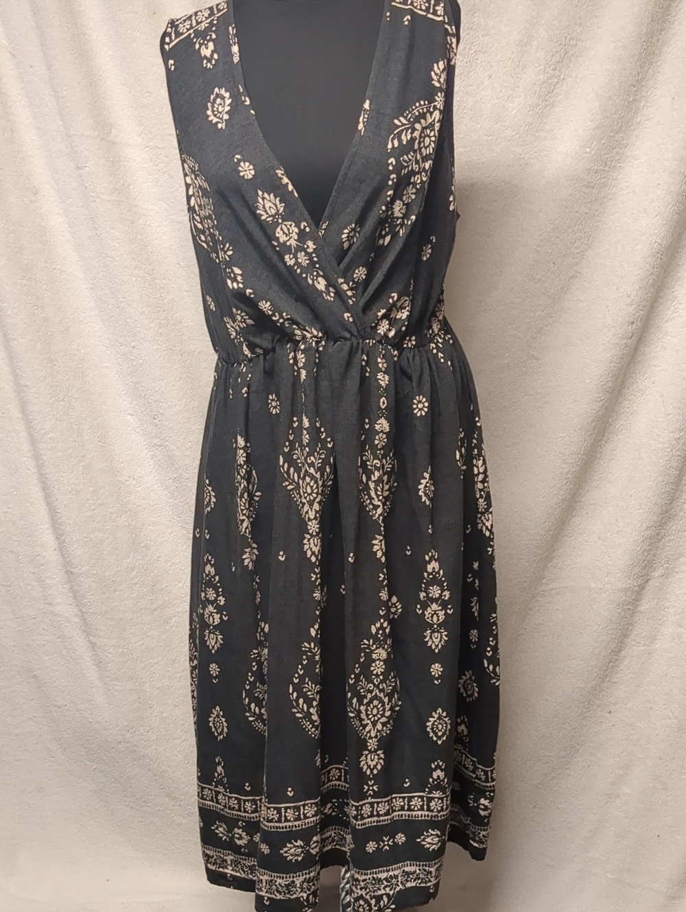 Black Sleeveless Wrap-Style Midi Dress with Cream Floral Print